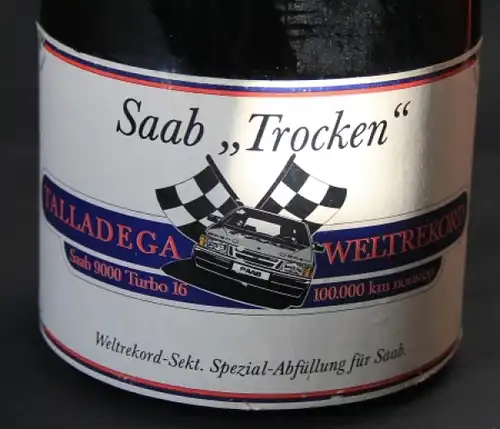 Saab 9000 Sektflasche 1986 "Weltrekord Sekt 100.000 km Talladega USA" Henkel (6878)