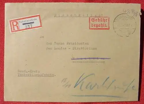 () Briefumschlag. Gebühr bezahlt. Einschreiben. Tauberbischofsheim 16. 10. 1945.  Alterungs- u. Gebrauchsspuren. Versand erfolgt in leicht gefaltetem Zustand als Standardbrief.