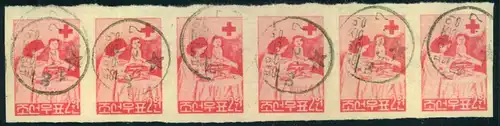 1957, 20 W RED CROSS, strip of six each stamp individually postmarked. The strip is folded between stamp 4 and 5.