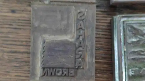 C58/ Acht Druckmatritzen Matrize Werbung aus Metall