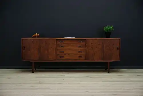 This rosewood sideboard was designed by Clausen & Søn and manufactured in Silkeborg Møbelfabrik in Denmark during the 1970s. The piece features spacious storage with...