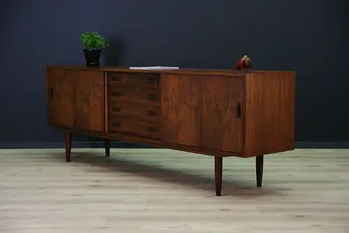 This rosewood sideboard was designed by Clausen & Søn and manufactured in Silkeborg Møbelfabrik in Denmark during the 1970s. The piece features spacious storage with...