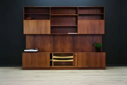 This rosewood wall unit was designed by Ib Koford-Larsen and manufactured in Faarup Møbelfabrik in Denmark in the 1970s. The piece features two cupboards (one...