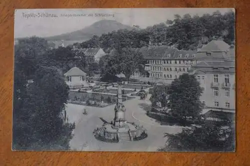 Ak Teplitz - Schönau, Kriegerdenkmal mit Schlossberg, um 1911 gelaufen