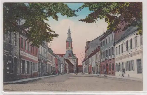 41931 Ak Grossenhain Naundorfer Strasse mit Geschäften um 1920