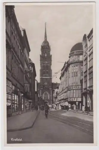 87764 Ak Krefeld Straßenansicht mit Geschäften 1942