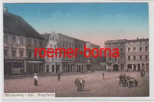 76107 Ak Münsterberg i.Schl. Ring-Partrie mit Café und Geschäften 1917