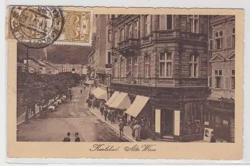 90389 Ak Karlsbad - Alte Wiese, Straßenansicht mit Geschäften, Uhrmacher 1920