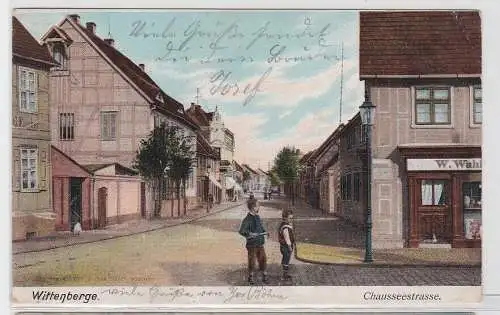 92870 AK Wittenberge - Chausseestrasse, Straßenansicht mit Geschäften 1907