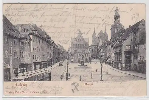 17560 AK Eisleben - Markt mit Geschäften, Lutherdenkmal und Straßenbahn 1903