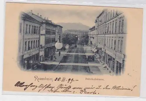 87247 AK Rosenheim - Bahnhofstrasse, Straßenansicht mit Kutsche 1899