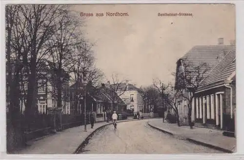 90049 AK Gruss aus Nordhorn - Bentheimer-Strasse, Straßenansicht mit Radfahrer