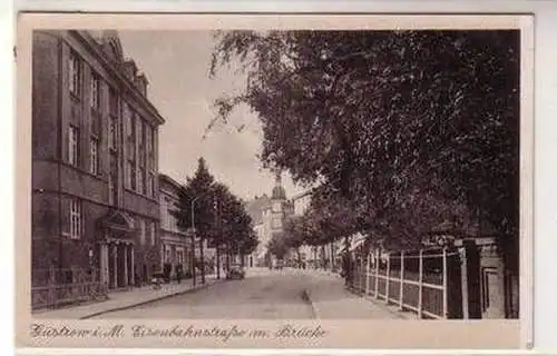 55273 Ak Güstrow in Meckl. Eisenbahnstraße mit Brücke um 1940