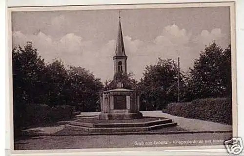 32482 Ak Gruß aus Gröditz Kriegerdenkmal mit Kirche