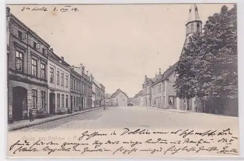 900042 AK Gruss aus Krakow in Mecklenburg - Straßenansicht mit Geschäften 1904