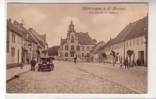 56486 Ak Heldrungen an der Unstrut Hauptstraße mit Rathaus um 1920