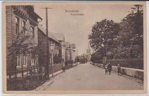 84319 AK Burscheid - Mittelstraße, Straßenansicht mit Kirche um 1920