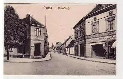 40989 Ak Güsten neue Strasse mit Geschäften 1925