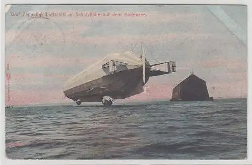 68057 Ak Graf Zeppelins Luftschiff mit Schutzhalle auf dem Bodensee 1908