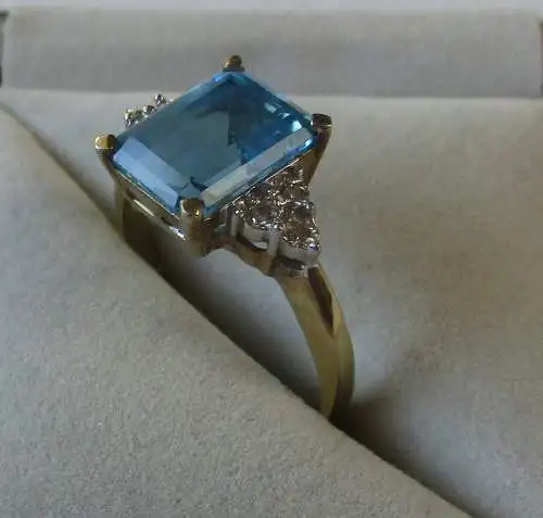 hochwertiger Damen Ring 333er Gold mit hellblauem Topas und 6 Diamanten (119246)