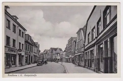 900487 AK Nordhorn - Hauptstraße, Straßenansicht mit Geschäften und Oldtimern 