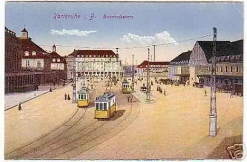 08659 Ak Karlsruhe i.B. Bahnhofsplatz mit Strassenbahn