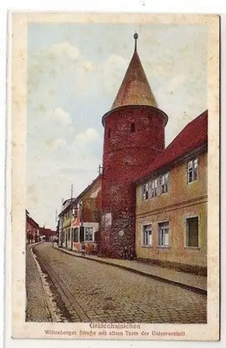 62031 Ak Gräfenhainichen Wittenberger Strasse mit altem Turm um 1920