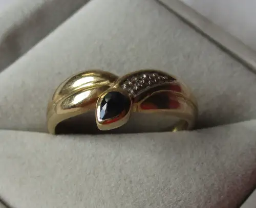 eleganter 333er Gold Ring mit Diamantsplitter und blauem Topas (111099)