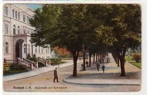 37387 Ak Rostock Wallstrasse mit Gymnasium um 1910