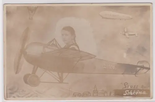 83883 Foto-Montage Ak Gruss aus Schköna. Mädchen im Flugzeug vor einem Zeppelin