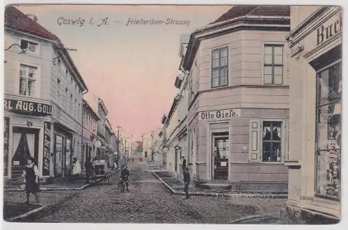 23029 Ak Coswig in Anhalt Friederiken Strasse mit Geschäften um 1910