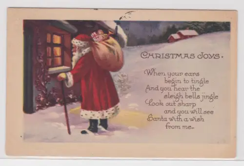 02469 Ak Christmas Joys - Weihnachtsmann mit Sack steht vor winterlichem Haus