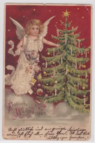 43696 AK Fröhliche Weihnachten. Engel streut Geschenke unter Weihnachtsbaum 1900