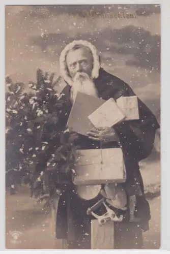 06437 Künstler AK Fröhliche Weihnachten, Weihnachtsmann mit Geschenken 1911