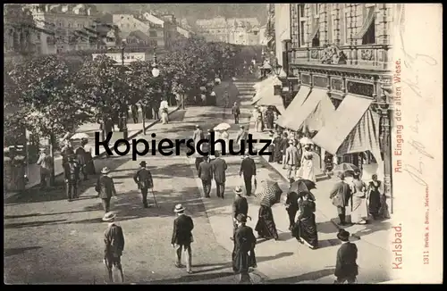 ALTE POSTKARTE KARLSBAD AM EINGANG DER ALTEN WIESE Karlovy Vary Ceska Republika Personen Hut hat chapeau umbrella cpa AK