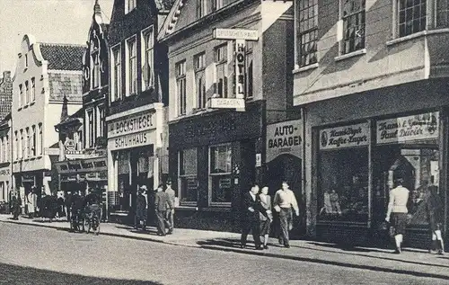 ÄLTERE POSTKARTE AURICH OSTFRIESLAND OSTERSTRASSE HERMANN HIPPEN UHREN BESTECK BOCKSTIEGEL SCHUHHAUS AUTO-GARAGEN cpa AK