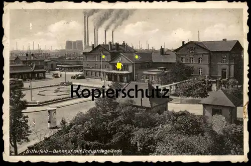 ALTE POSTKARTE BITTERFELD BAHNHOF MIT INDUSTRIEGELÄNDE 1939 Beflaggung Symbol station gare Industrie industry postcard