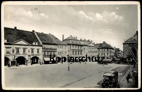 ALTE POSTKARTE KOMOTAU MARKTPLATZ FRANZ WATZELT JOSEF KONIRSCH Chomutov Bus Busse Omnibus Böhmen Ansichtskarte postcard