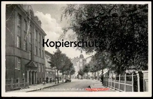 ALTE POSTKARTE GÜSTROW I. M. EISENBAHNBRÜCKE MIT BLICK AUF DIE A. H. (UNKENNTLICH) STRASSE postcard cpa Ansichtskarte