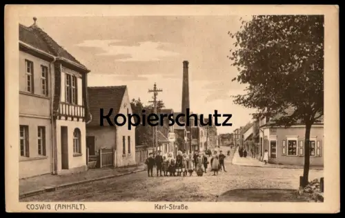 ALTE POSTKARTE COSWIG ANHALT KARL-STRASSE KINDER MÄDCHEN JUNGEN Sachsen-Anhalt cpa postcard AK Ansichtskarte
