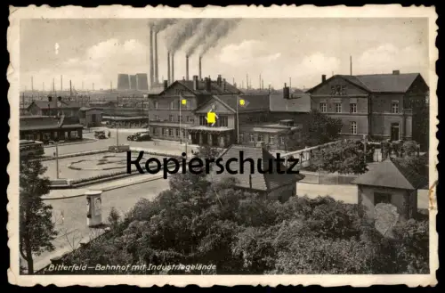 ALTE POSTKARTE BITTERFELD BAHNHOF MIT INDUSTRIEGELÄNDE 1939 Beflaggung Symbol station gare Industrie industry postcard
