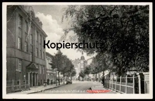 ALTE POSTKARTE GÜSTROW I. M. EISENBAHNBRÜCKE MIT BLICK AUF DIE A. H. (UNKENNTLICH) STRASSE postcard cpa Ansichtskarte