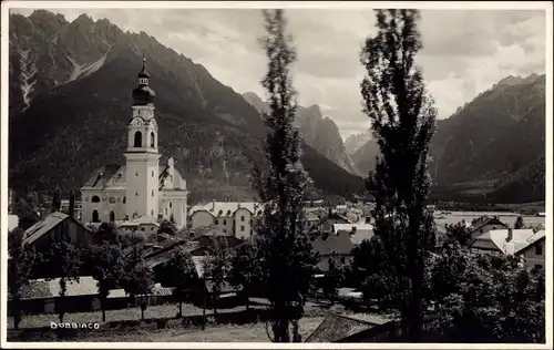 Ak Dobbiaco Toblach Südtirol Italien, Blick auf den Ort, Gebirge, Kirche