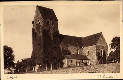 Ak Lügde im Weserbergland, Ansicht der Kilianskriche mit Friedhof