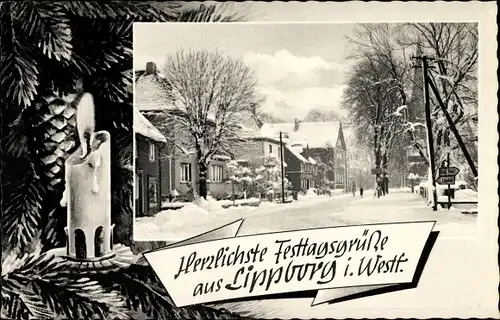Passepartout Ak Lippborg Lippetal Nordrhein Westfalen, verschneite Straße, Weihnachtskerze