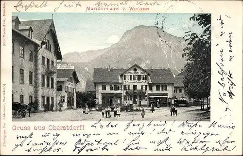 Ak Oberstdorf im Oberallgäu, Westblick auf den Marktplatz, Buchhandlung, Passanten