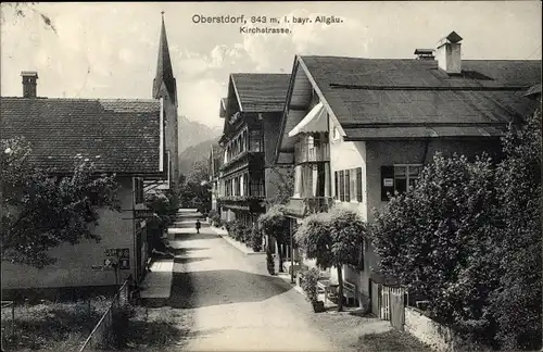 Ak Oberstdorf im Oberallgäu, Kirchstraße mit Blick zur Kirche, Gasthaus, Delikatessengeschäft