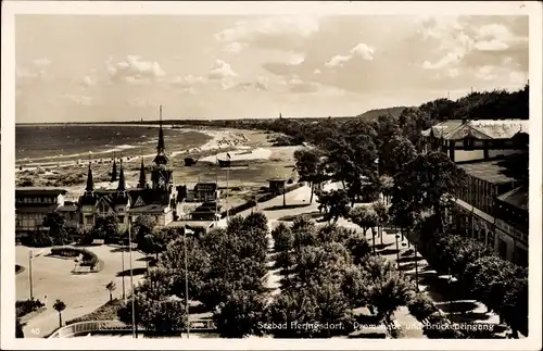 Ak Ostseebad Heringsdorf auf Usedom, Promenade und Brückeneingang