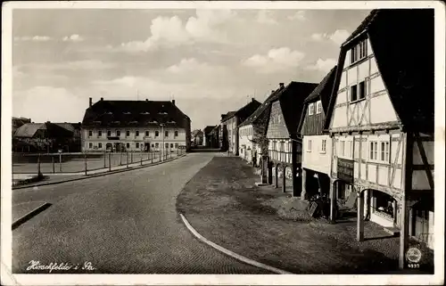 Ak Hirschfelde Zittau in der Oberlausitz, Marktplatz, Fachwerkhaus, Eisenwarengeschäft