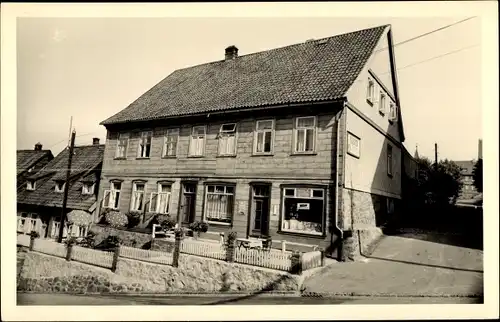 Foto Ak St. Andreasberg Braunlage im Harz, Blick auf Gebäude mit Geschäft, Breitestraße